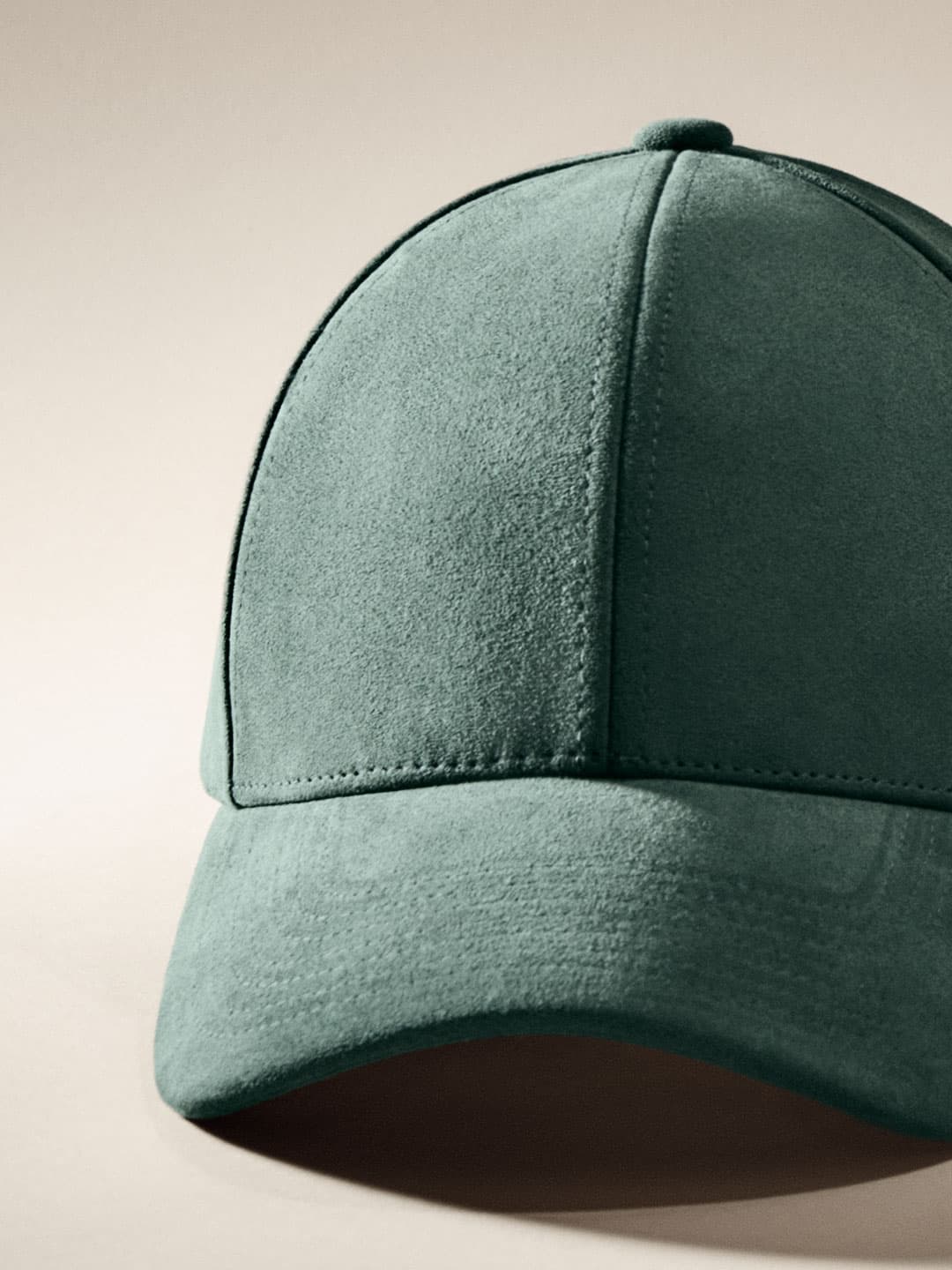 Close front view of green alcantara cap from Varsity Headwear autumn winter 25 collection