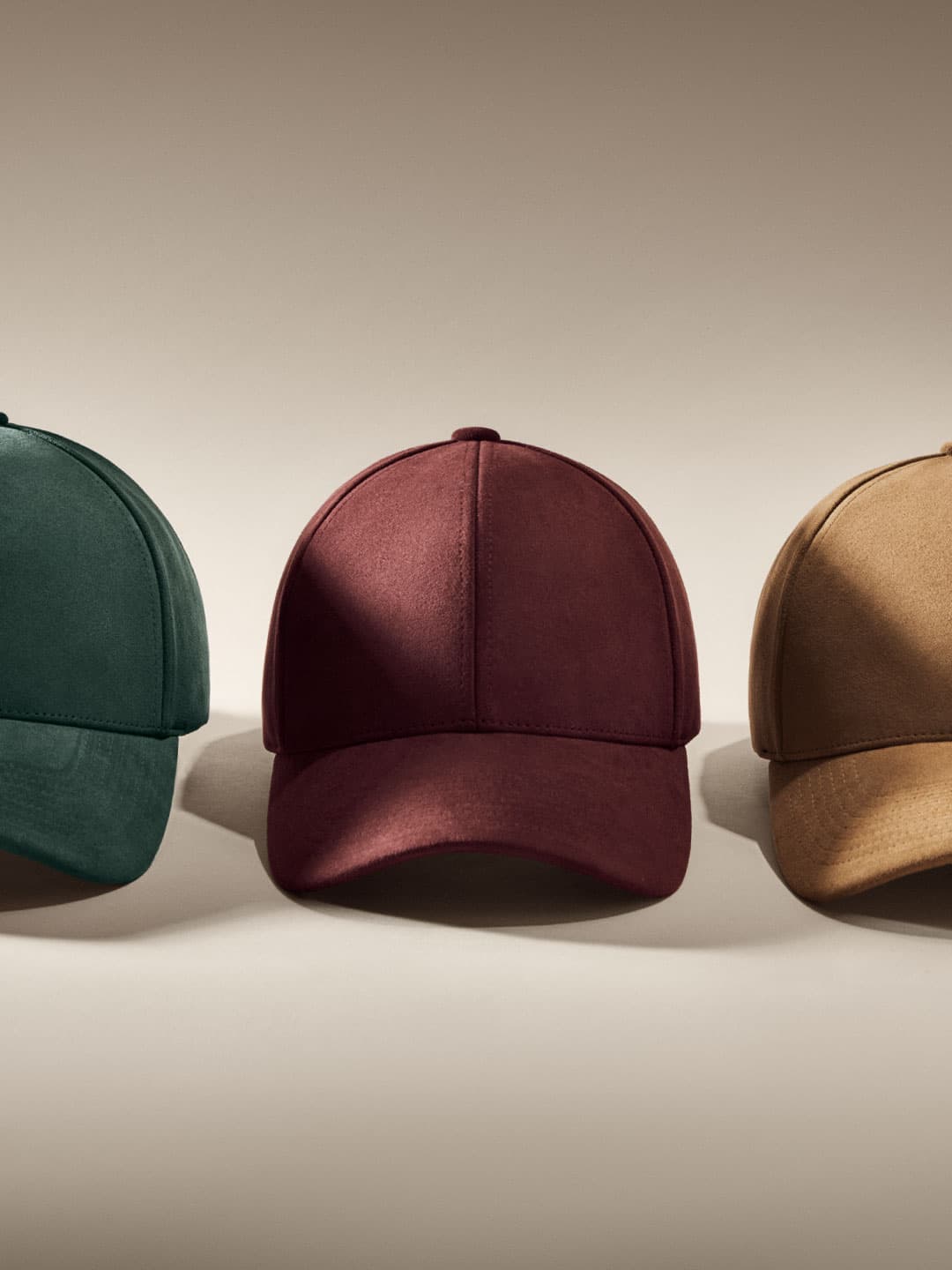 Front view of alcantara caps from varsity headwear in green, burgundy and brown