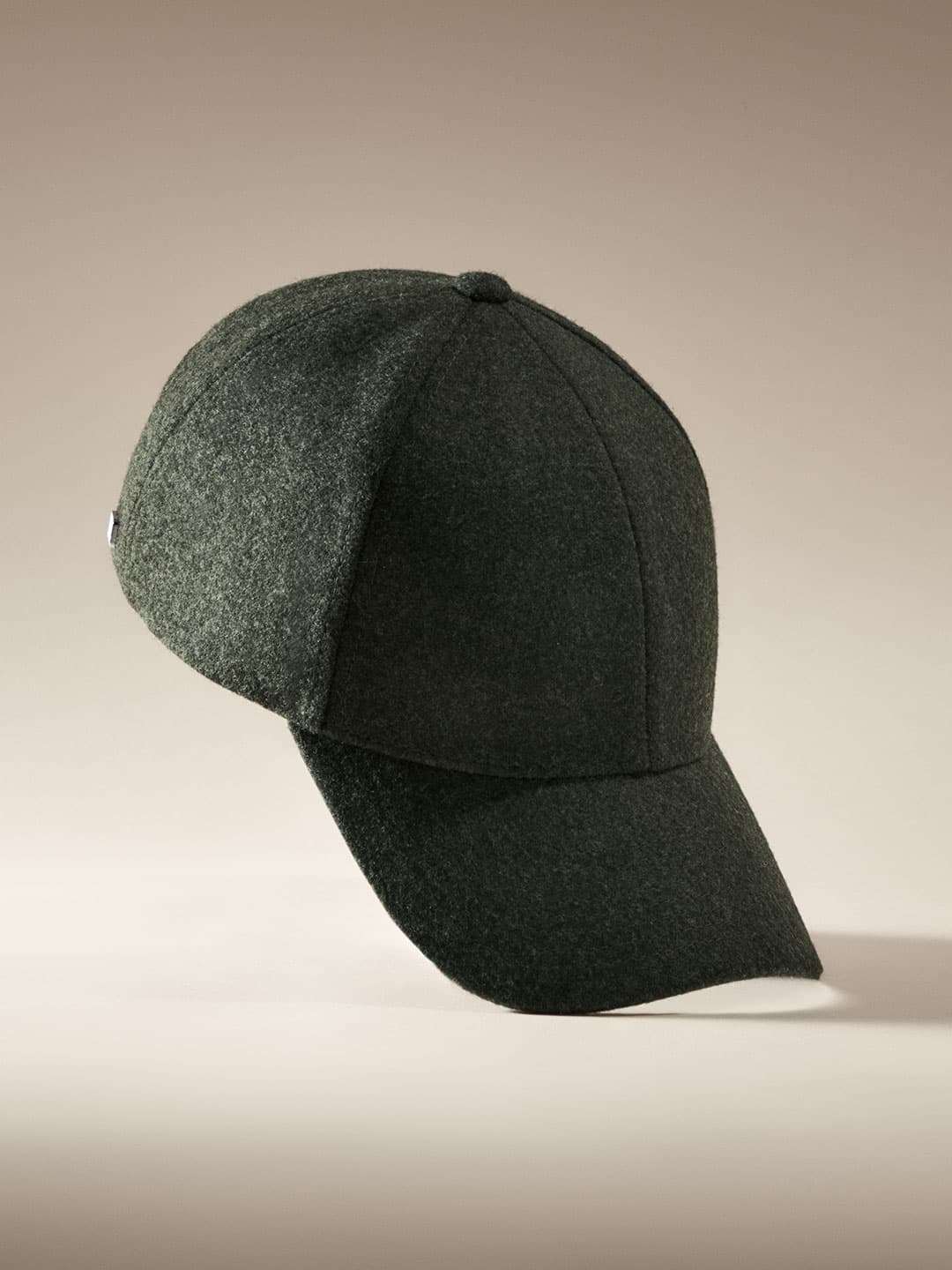 Studio image of a forest green wool cap from varsity headwear