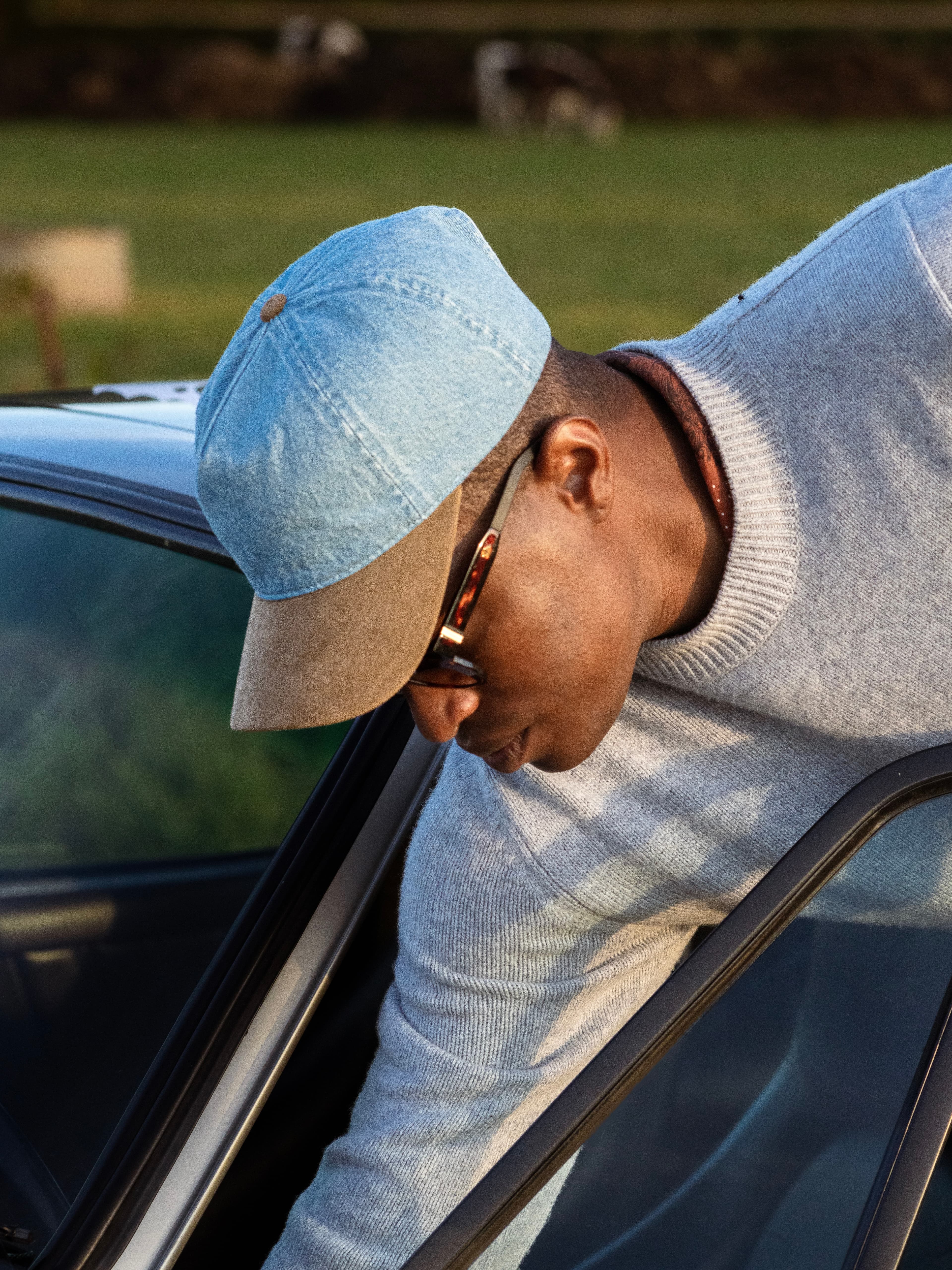 Side view of male wearing soft cruz cap in denim and alcantara